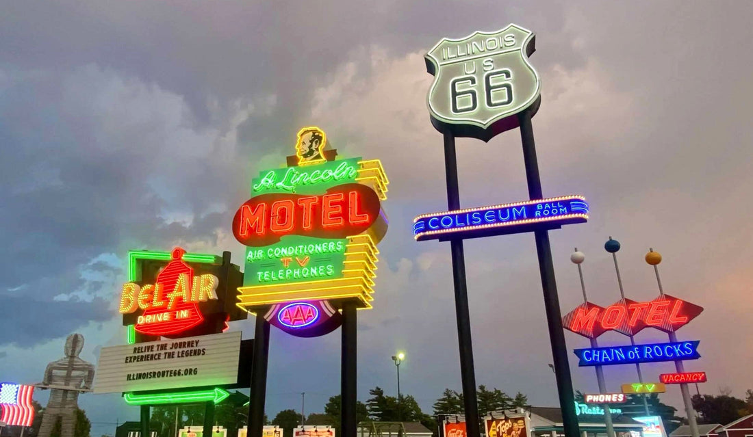 Series of vintage glowing hotel and motel shields and signs at a neon sign park