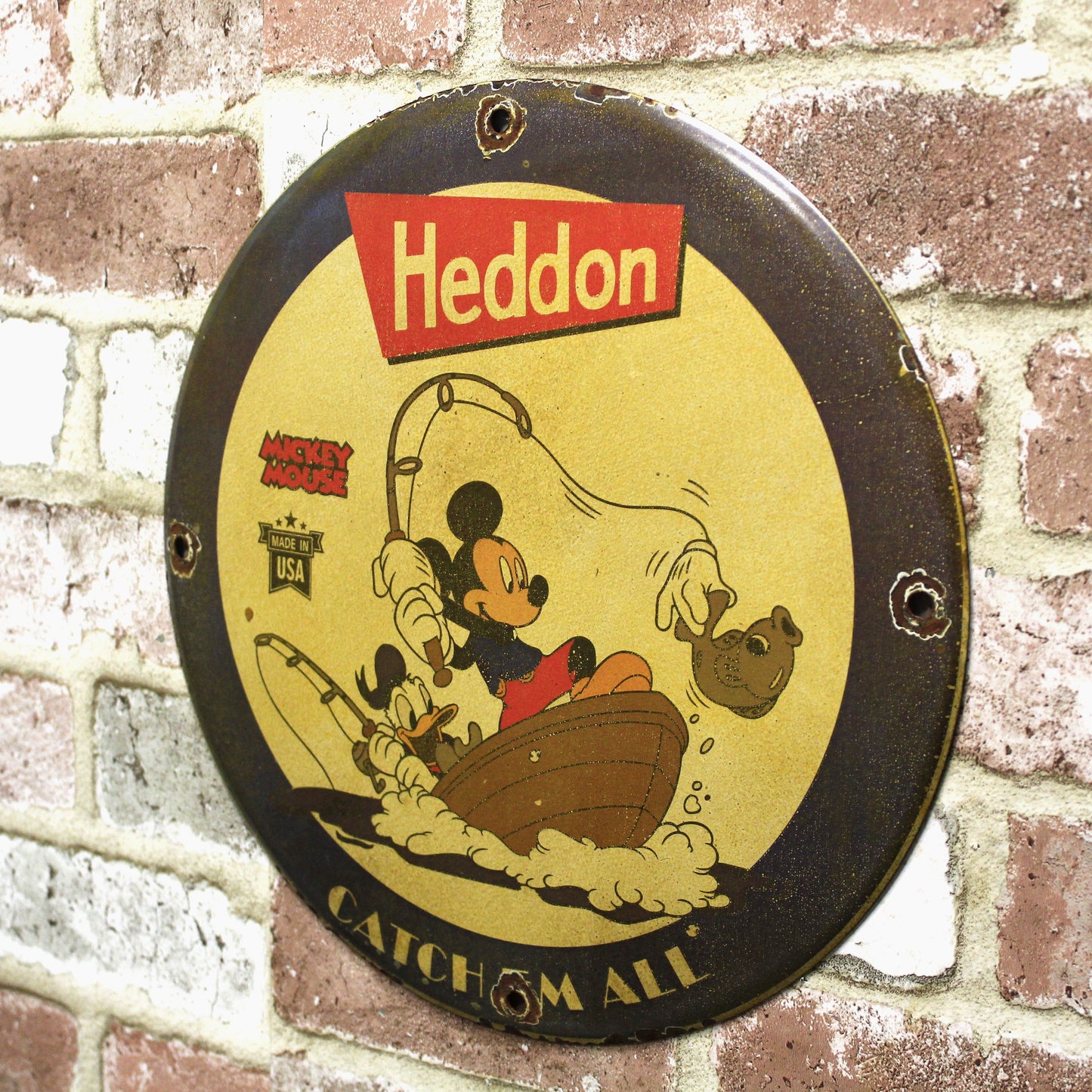 Heddon Catch Em All with Mickey & Donald Porcelain Enamel Sign (12in)