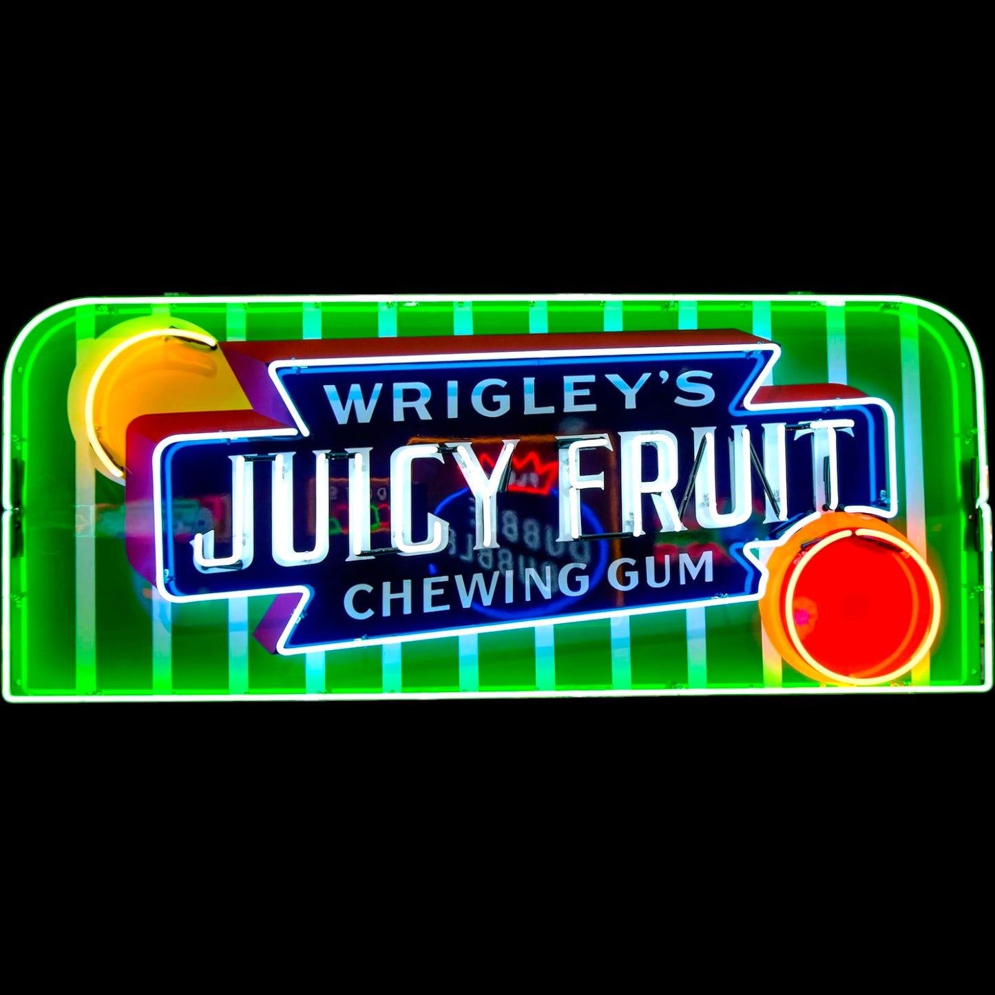 Neon sign for Wrigley's Juicy Fruit chewing gum with colorful design on a black background
