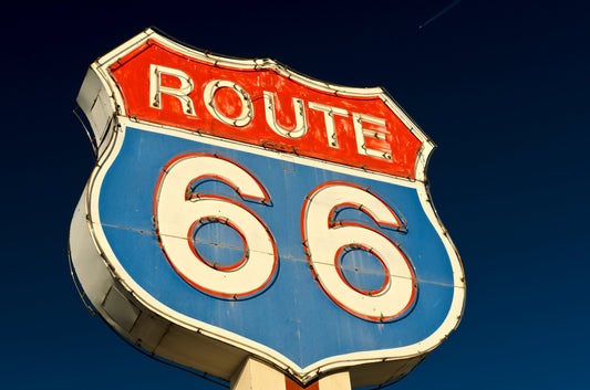 Iconic Route 66 Neon Shield Sign on Top of Pole
