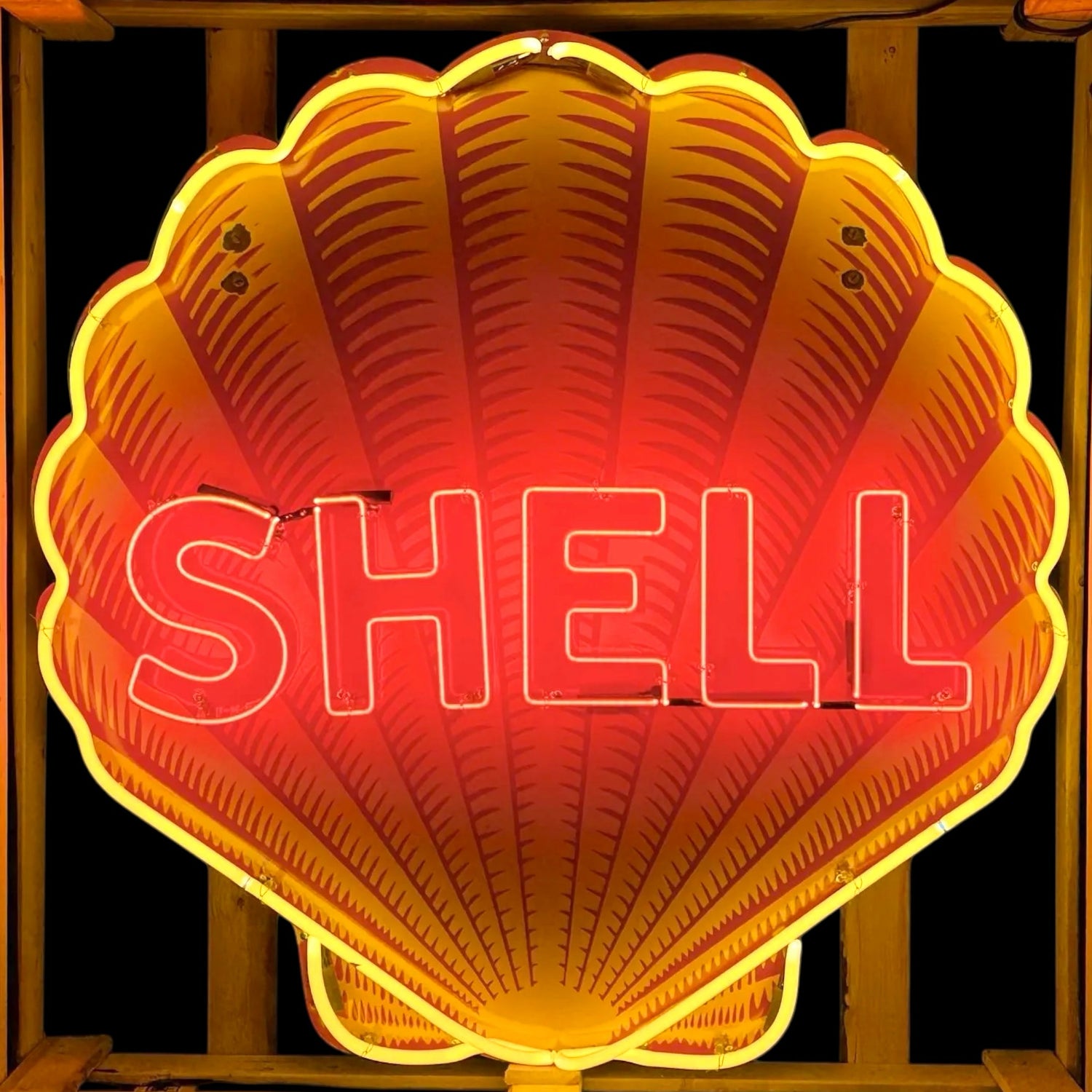 Shell sign in classic die-cut clam/scallop shell shape with real neon glow