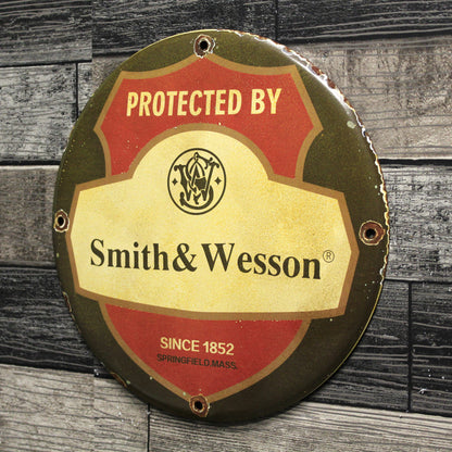 Protected by Smith & Wesson Porcelain Enamel Sign (12in)