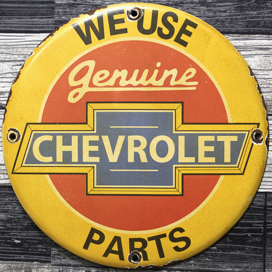 We Use Chevrolet Parts Porcelain Enamel Sign (12in)