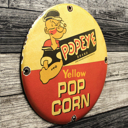 Yellow Pop Corn Popeye Brand Porcelain Enamel Sign (12in)