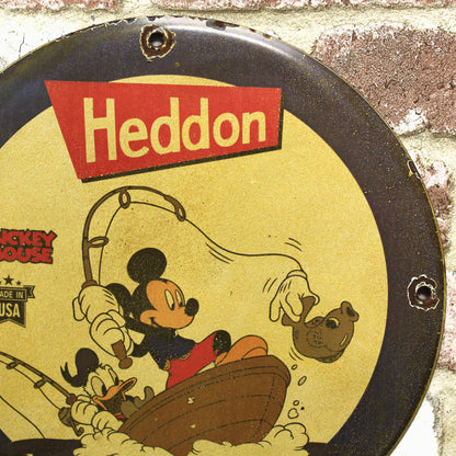 Heddon Catch Em All with Mickey & Donald Porcelain Enamel Sign (12in)