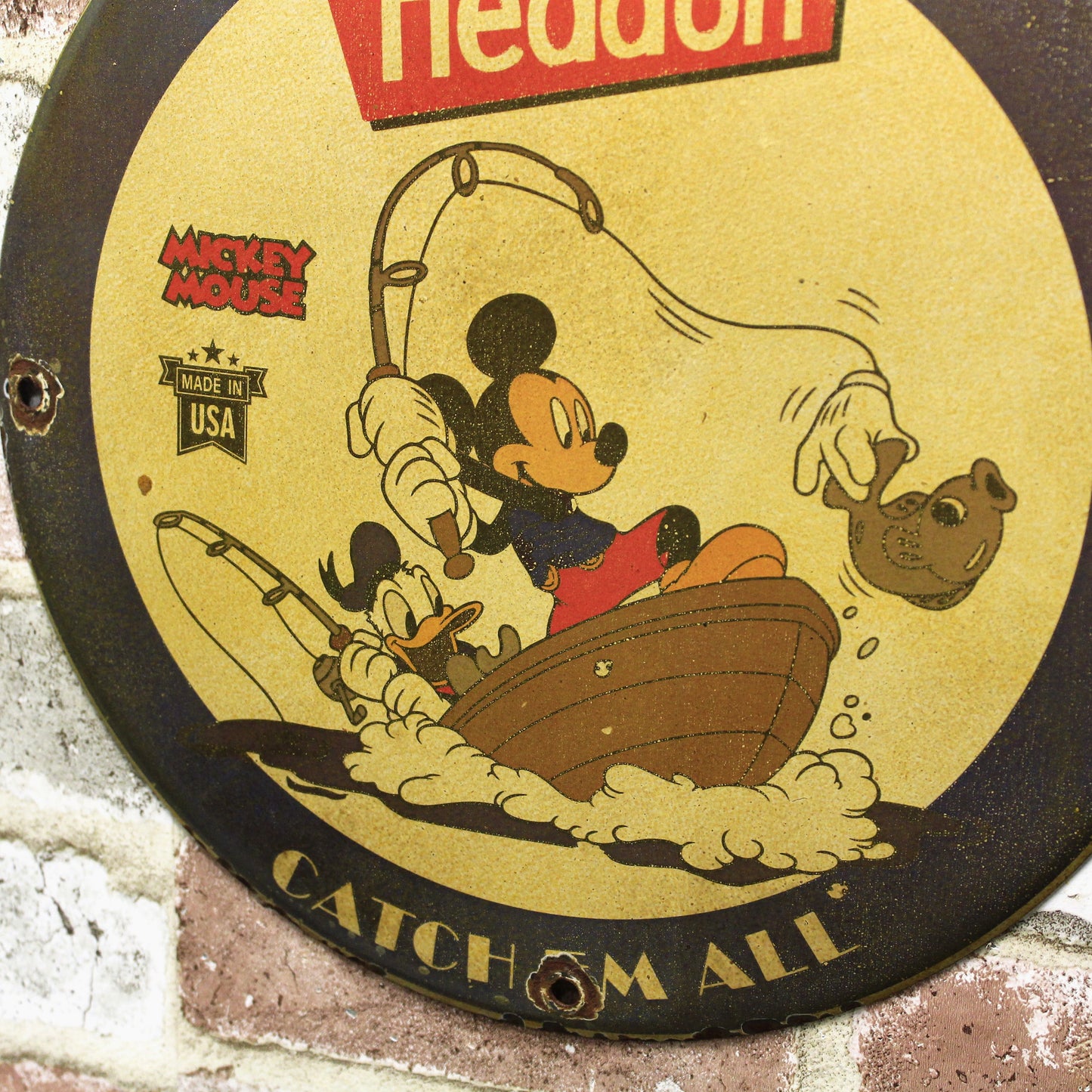 Heddon Catch Em All with Mickey & Donald Porcelain Enamel Sign (12in)