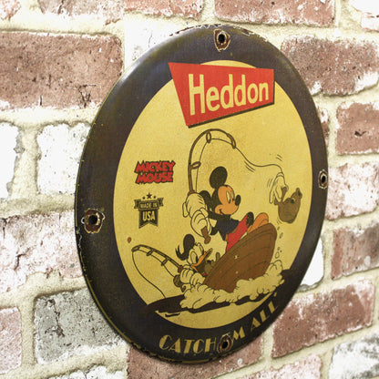 Heddon Catch Em All with Mickey & Donald Porcelain Enamel Sign (12in)