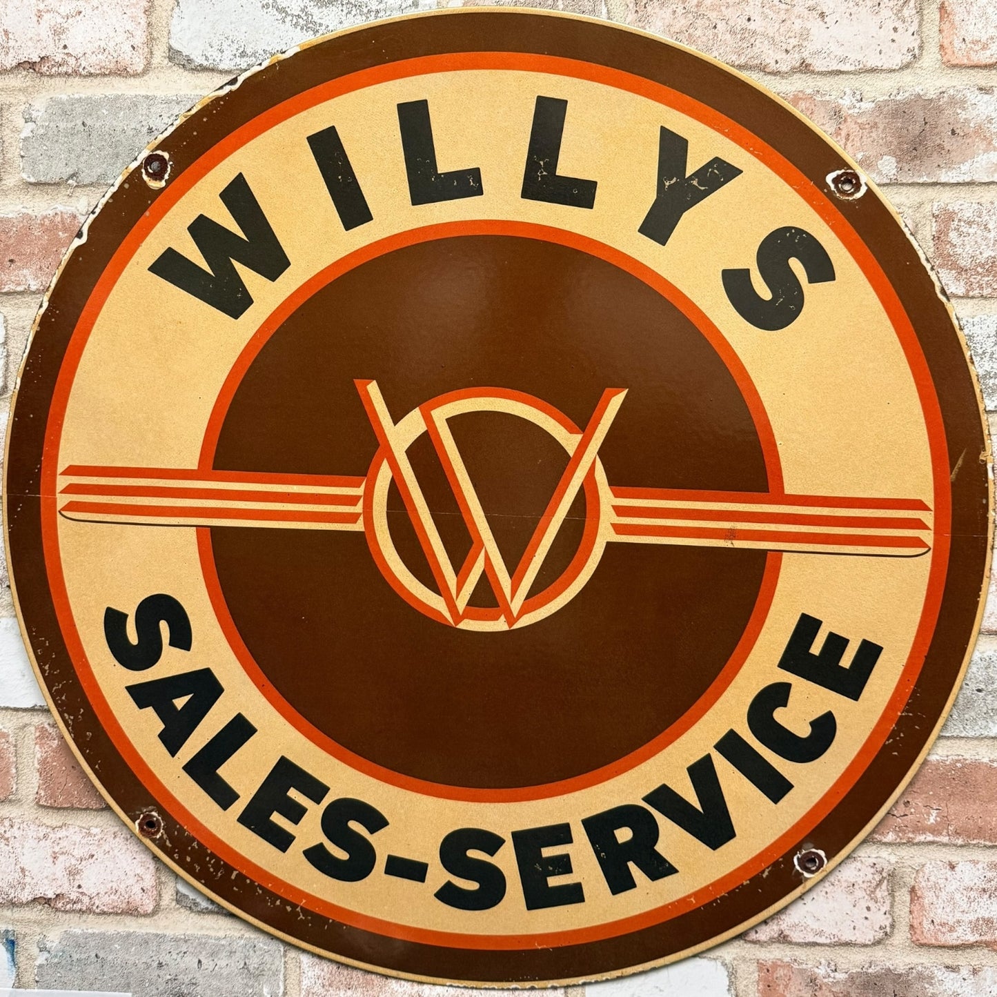 Willys Sales-Service sign on a brick wall background