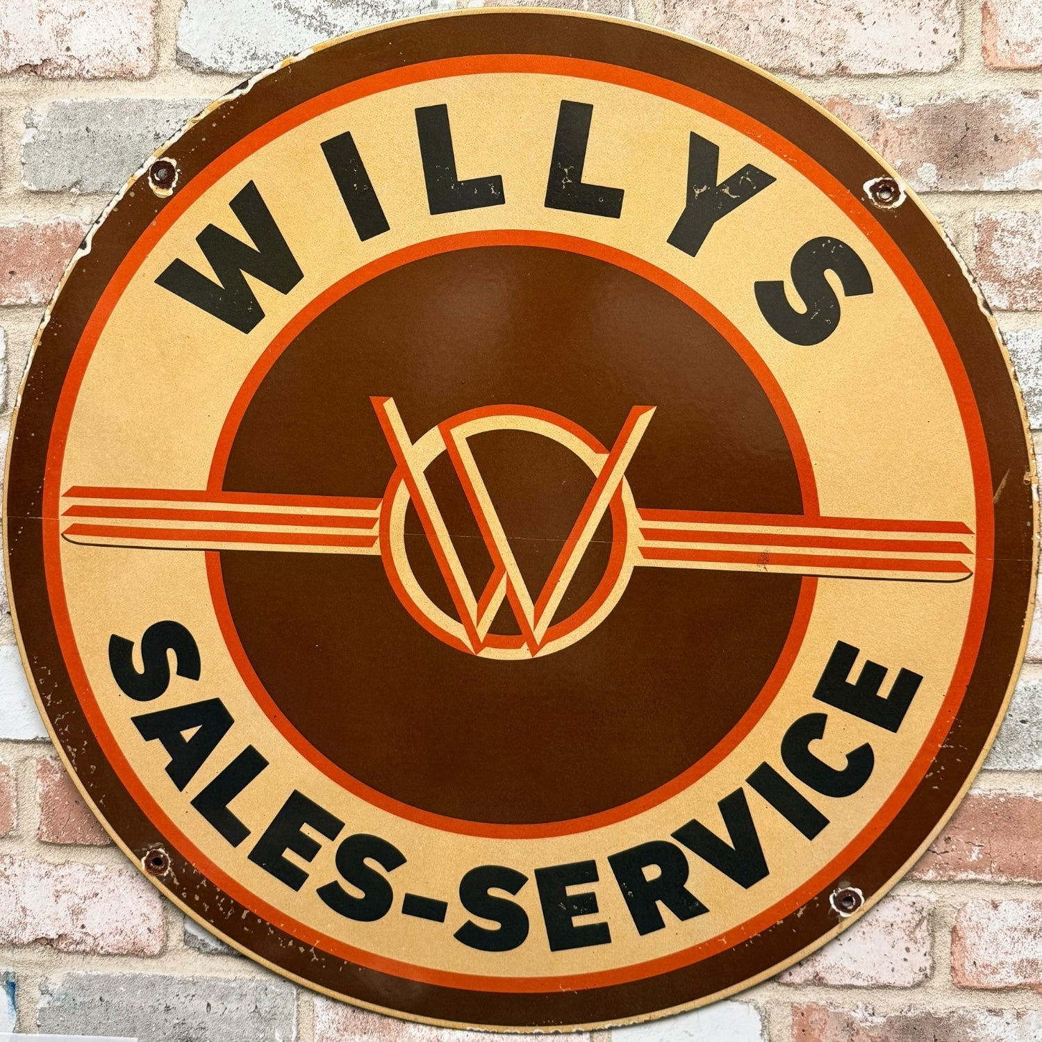 Willys Sales-Service sign on a brick wall background