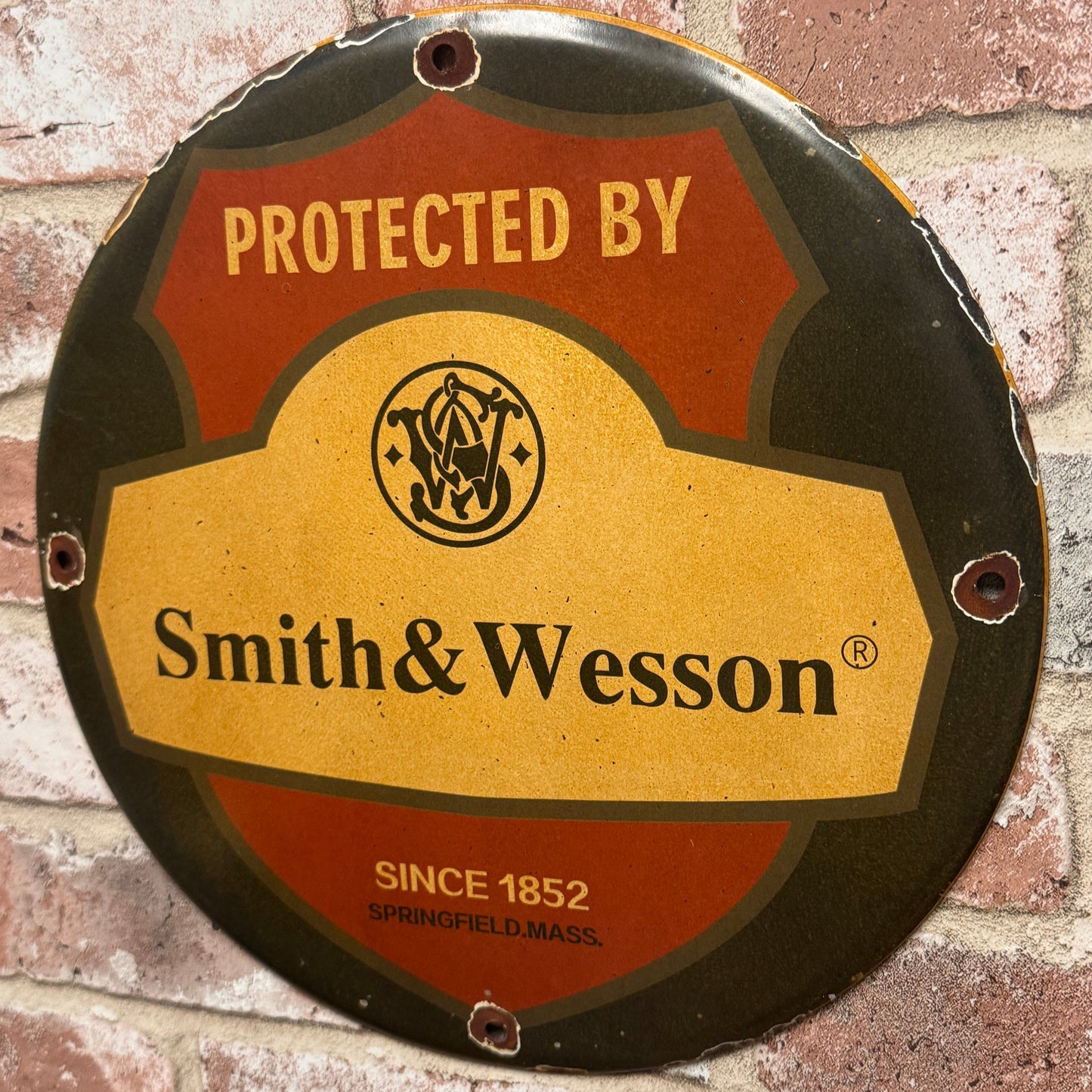 Protected by Smith & Wesson Porcelain Enamel Sign (12in)