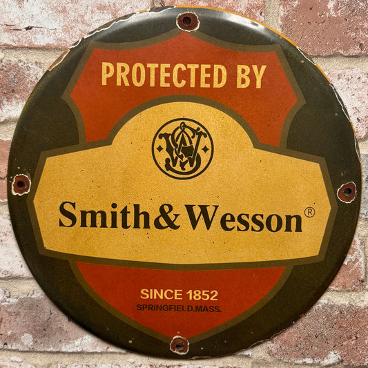 Protected by Smith & Wesson Porcelain Enamel Sign (12in)