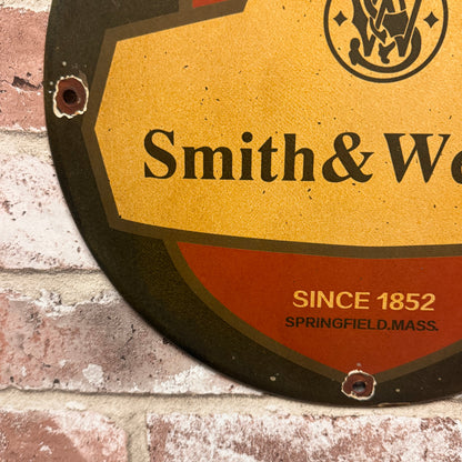 Protected by Smith & Wesson Porcelain Enamel Sign (12in)