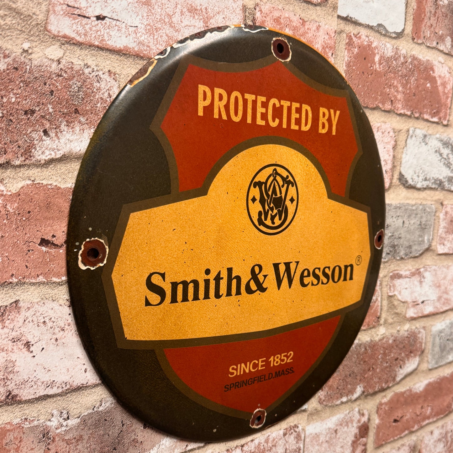 Protected by Smith & Wesson Porcelain Enamel Sign (12in)