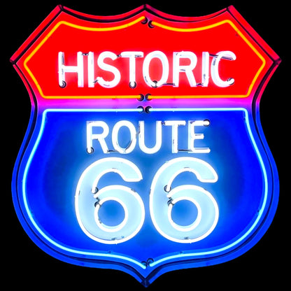 Glowing iconic highway road sign with a die cut shield design glowing with History Route 66