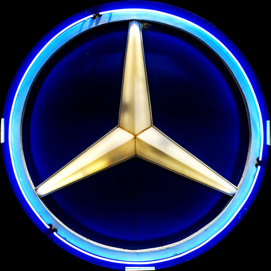 Mercedes-Benz logo with gold star and blue circular background