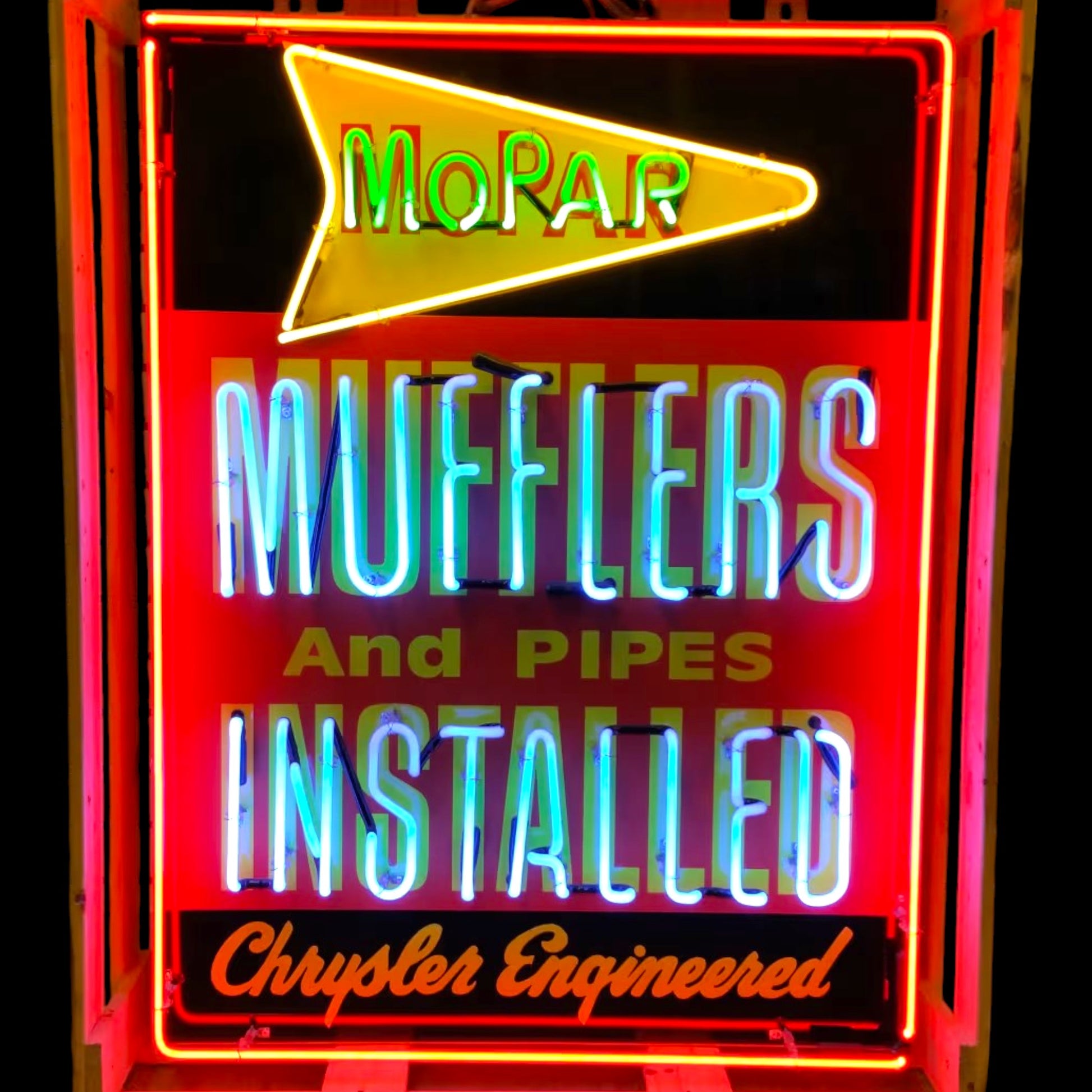 Mopar Mufflers Installed neon sign with red porcelain face, glowing letters, and Chrysler Engineered banner
