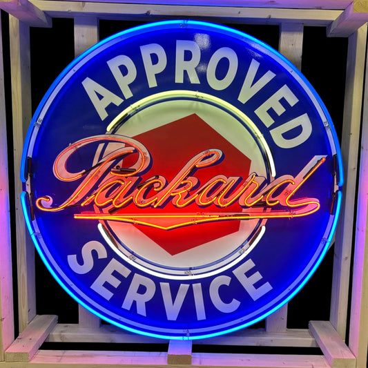 Neon sign with 'Approved Packard Service' text on a dark background