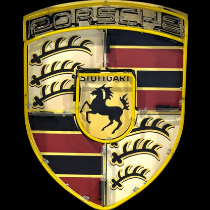Porsche logo with a shield design featuring a horse and striped pattern on a black background