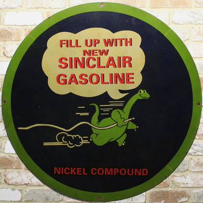 Round sign advertising Sinclair Gasoline with a green dinosaur logo on a brick wall background.