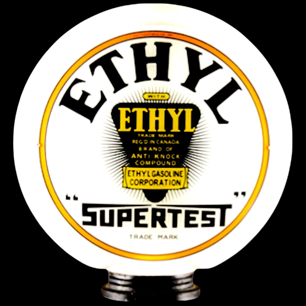 Vintage Ethyl SuperTest gasoline pump globe on a black background