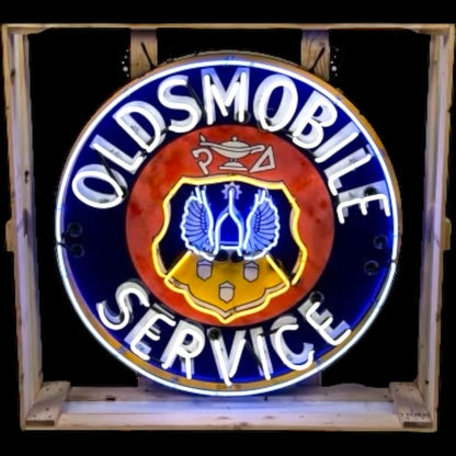 Neon sign for Oldsmobile service with glowing text and logo.
