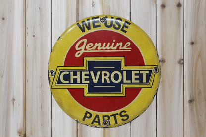 We Use Genuine Chevrolet Parts 12in Porcelain Enamel Sign - PORCELAIN ADVERTISING - Sign